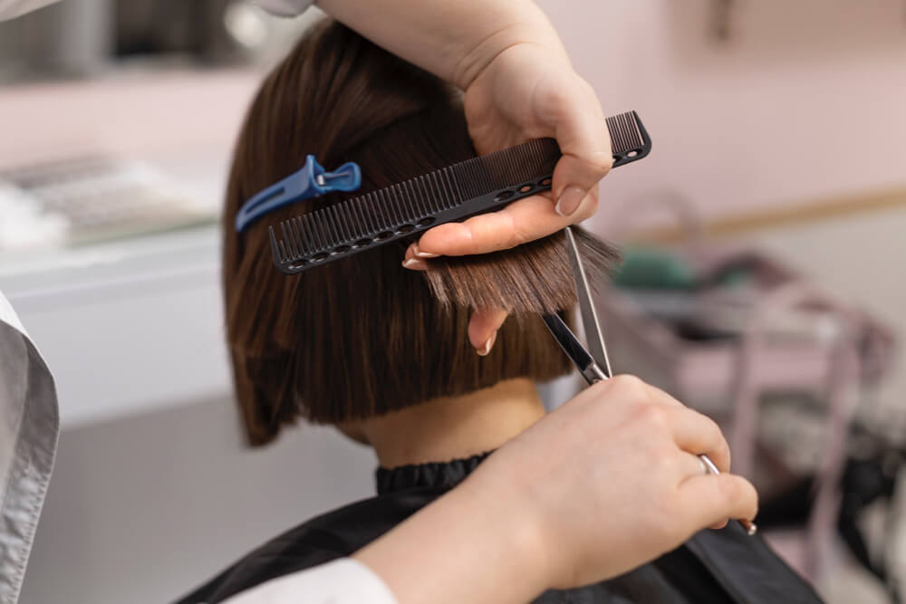 woman-getting-treatment-hairdresser-shop-2